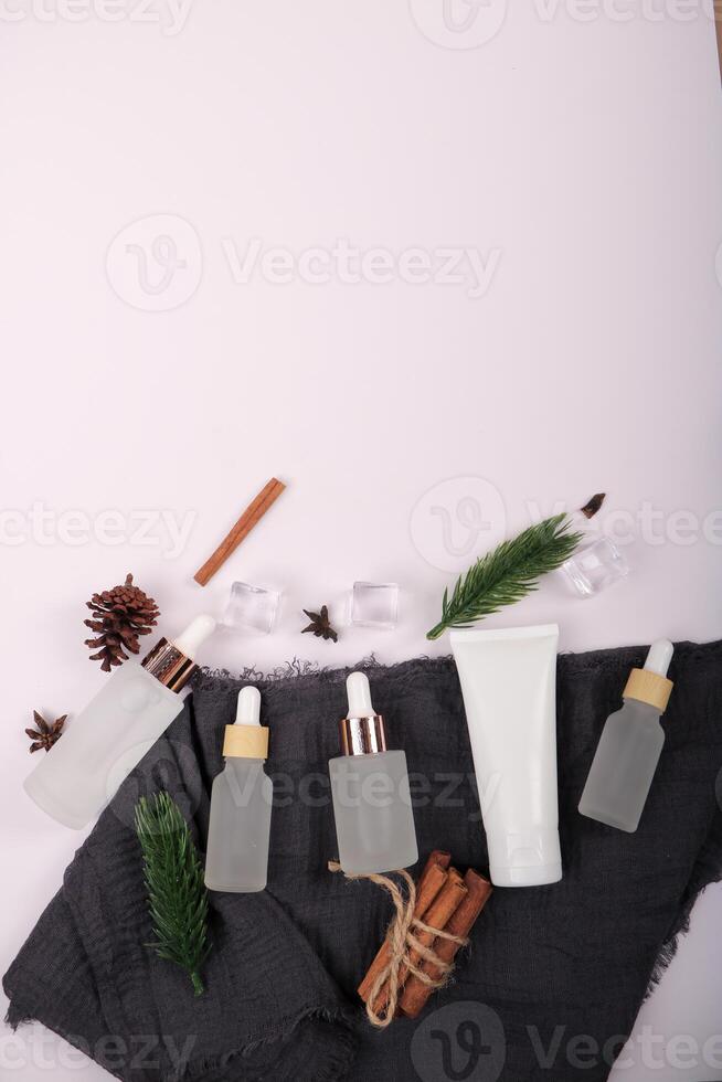 Natural Skincare Serums and Creams with Botanical Elements on White Background photo