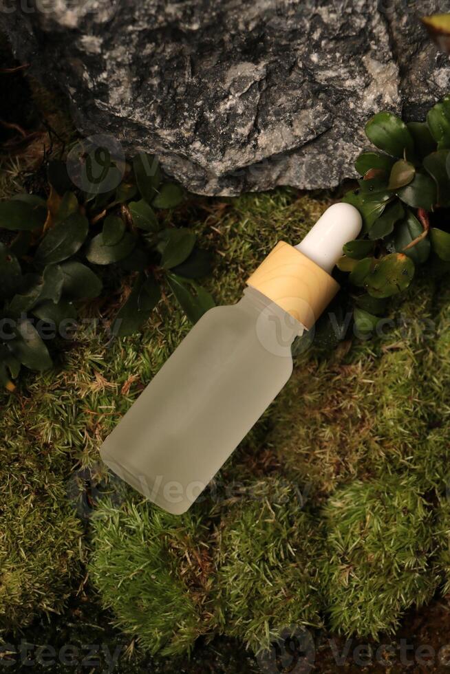 Pipette bottle with natural background photo