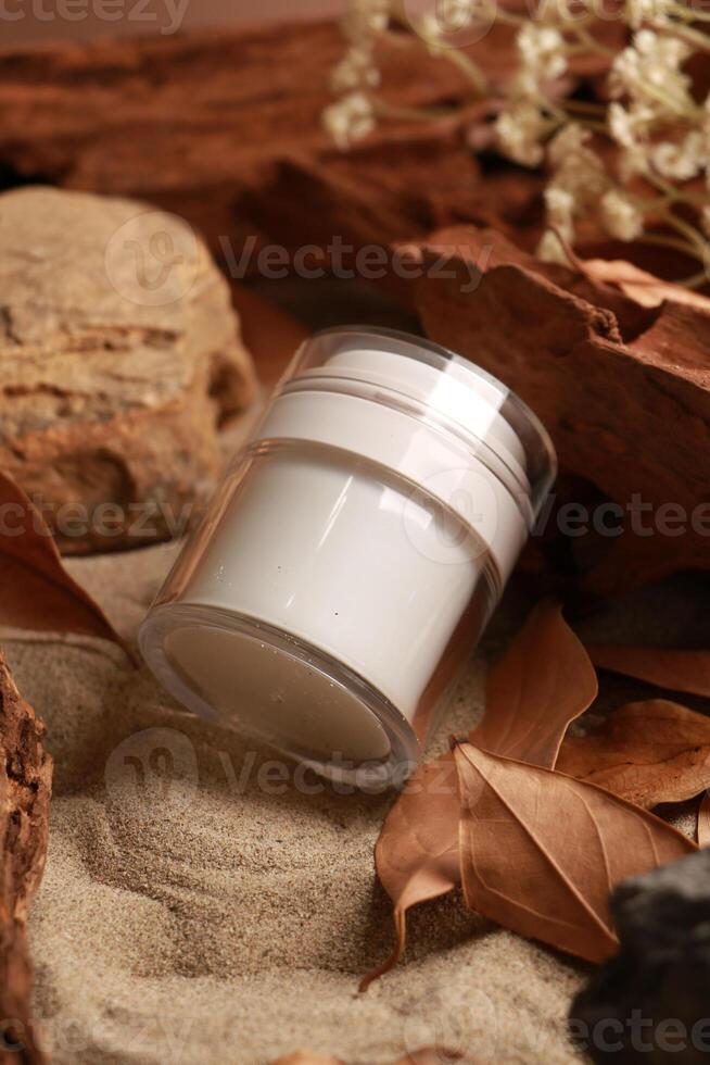 Natural Skincare Cream Jar on Sandy Background with Rustic Elements photo