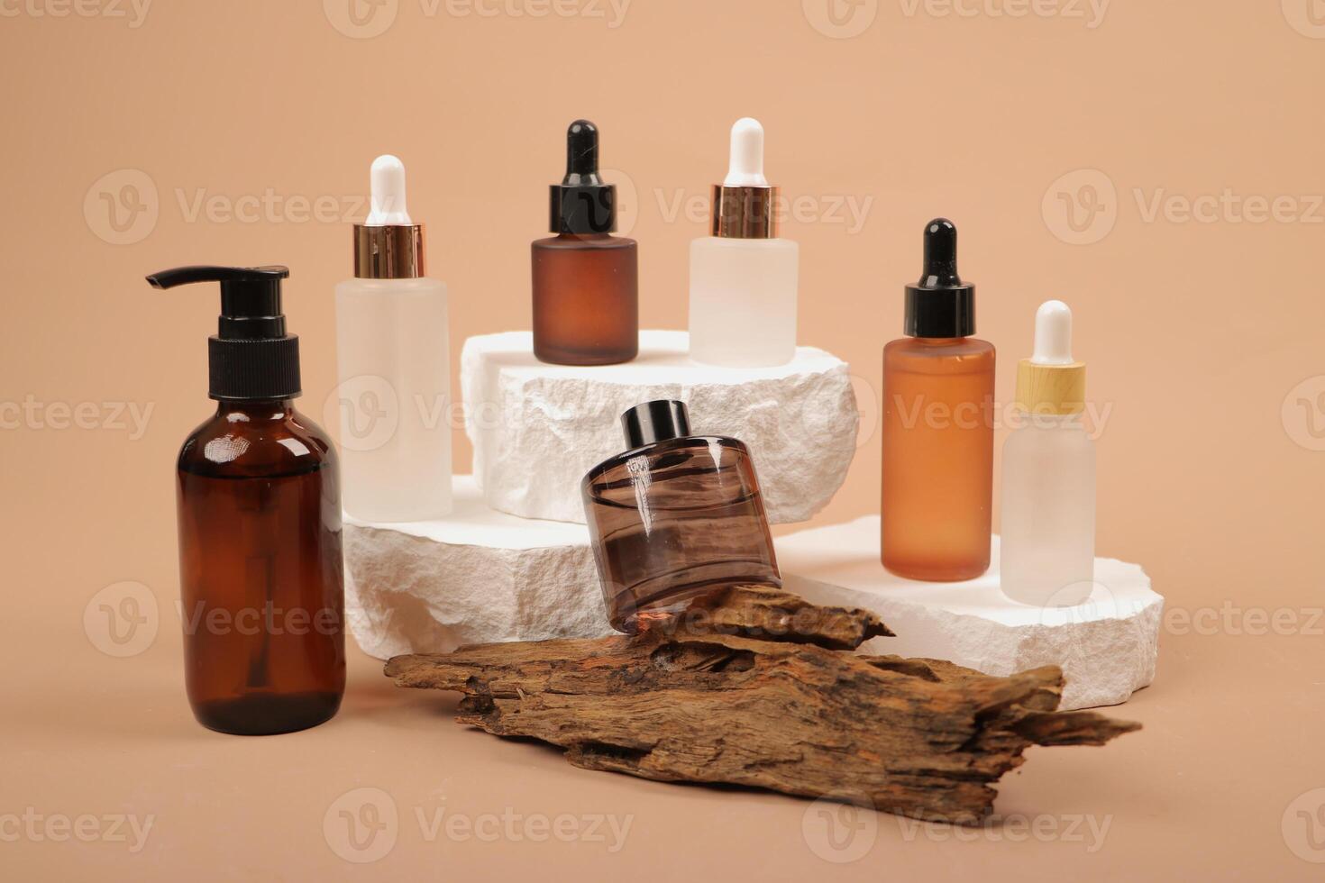 Assorted Luxury Skincare Bottles on Stone Pedestals with Natural Elements photo