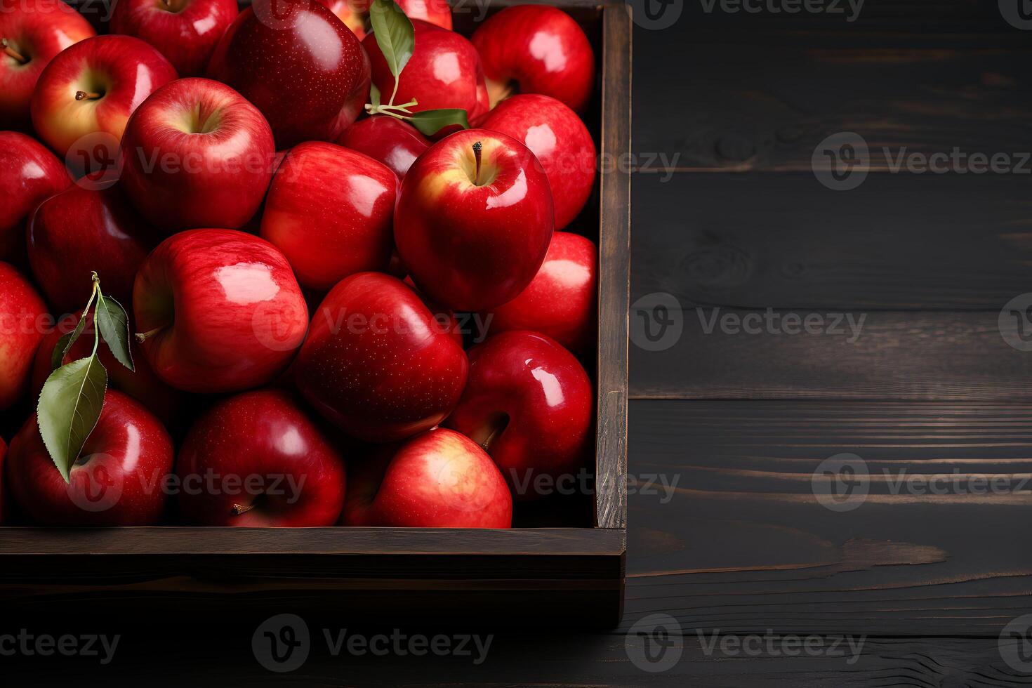 Wooden box with fresh red apples on wooden background, top view photo