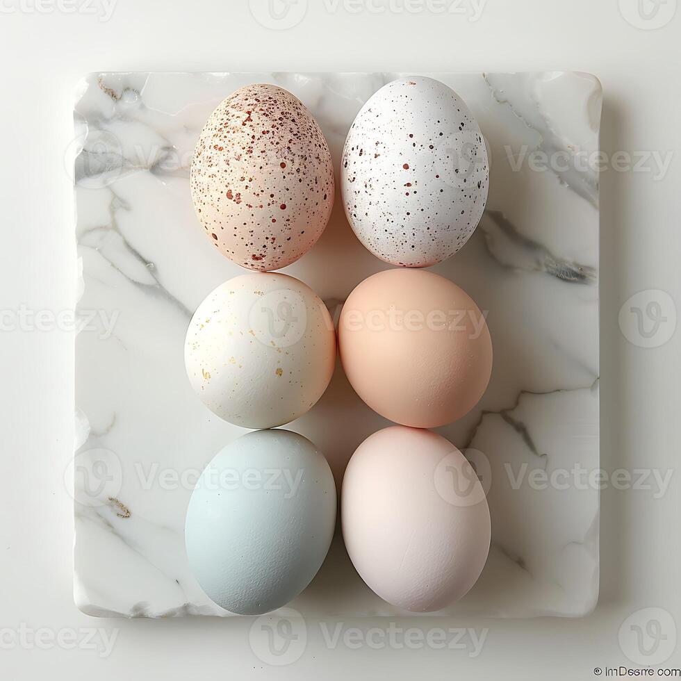 Easter eggs on white marble background. Top view, flat lay photo