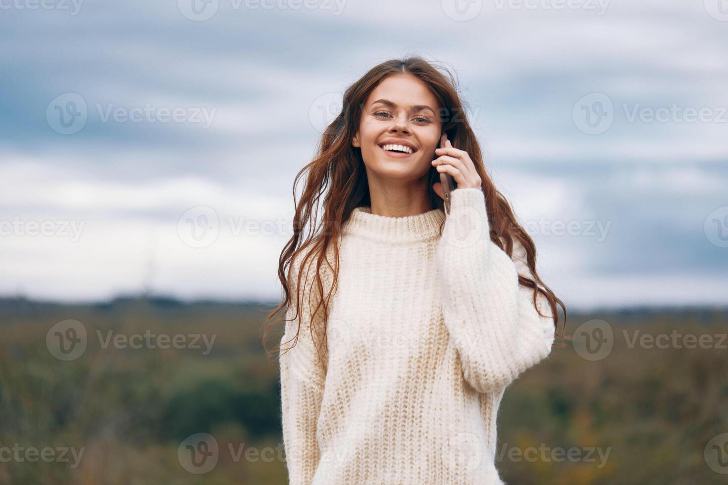Mountain Woman. Connecting with Nature and Enjoying a Free- Spirited Adventure, Capturing a Selfie photo