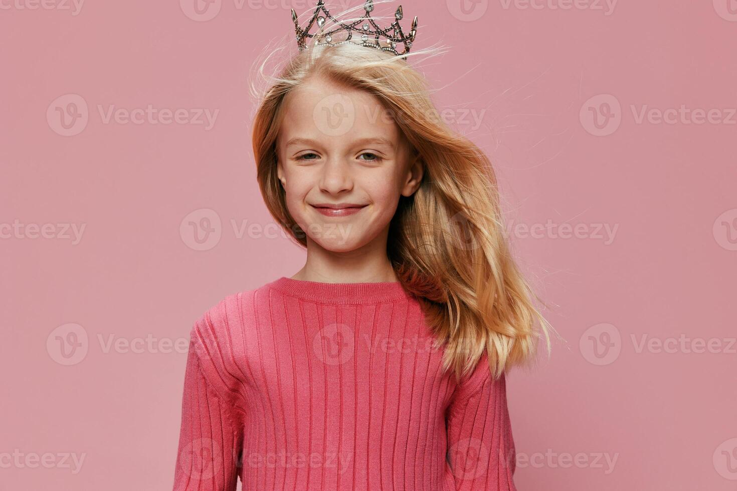 Cute Little Girl with a Pink Princess Crown Celebrating her Birthday in a Joyful and Magical photo