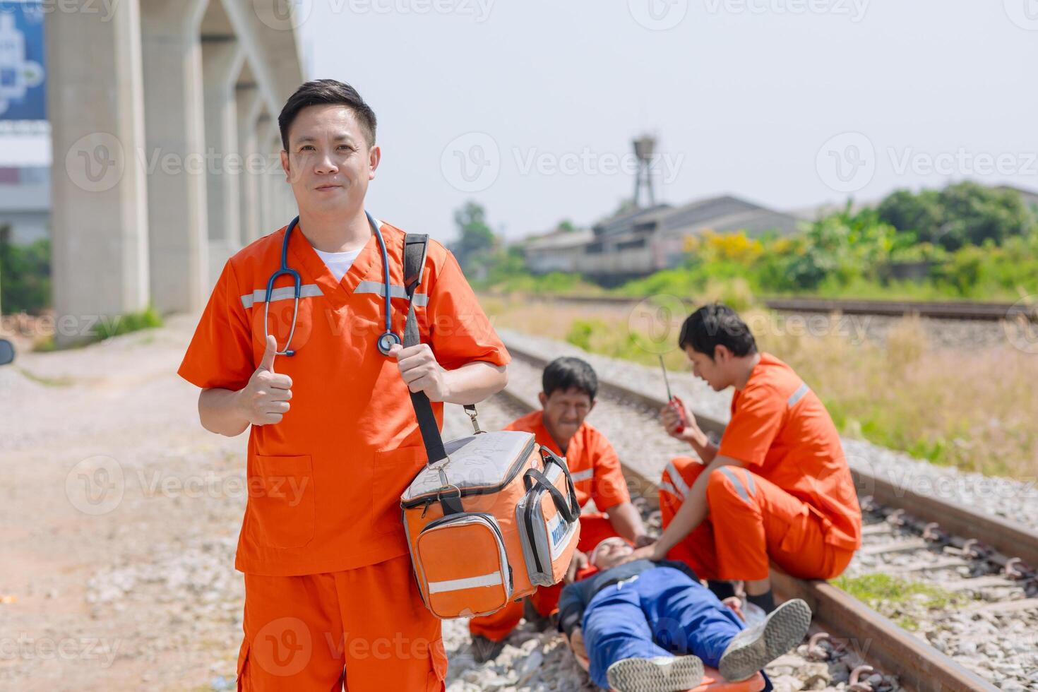 paramedic medical emergency doctor team working in action help first aid save people life at accident site outdoors photo