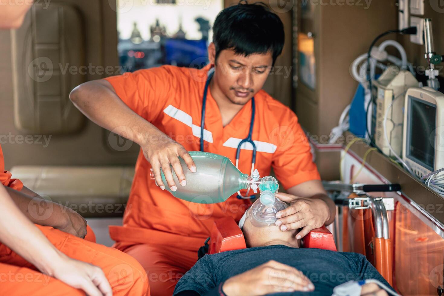 paramedic mobile car medical emergency team working in action help first aid save people life at accident site outdoors photo