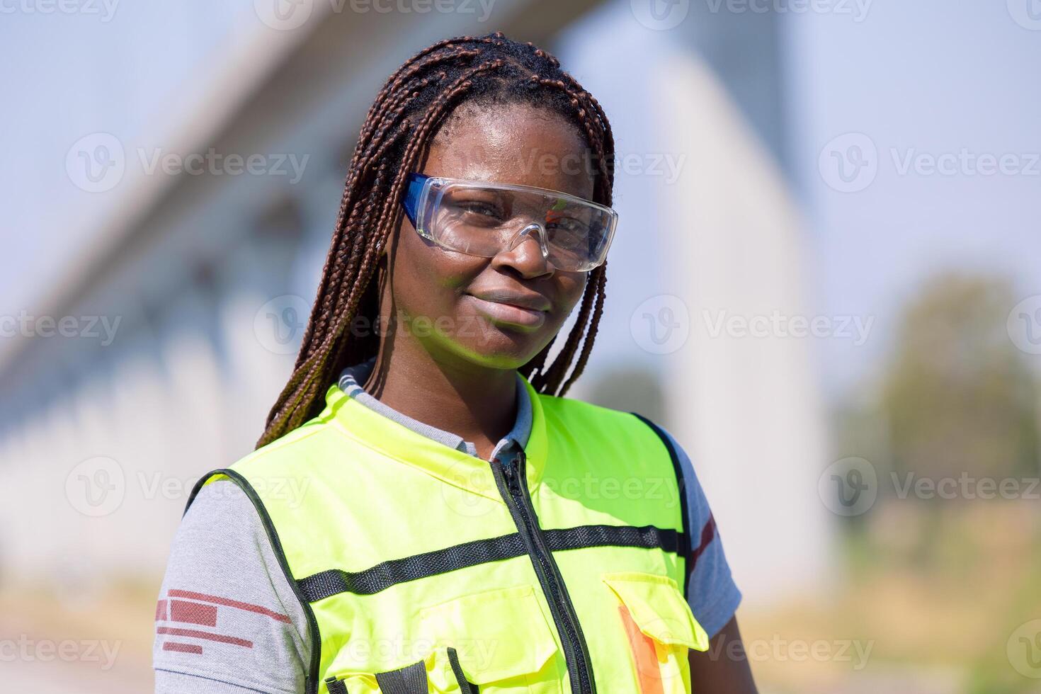Portrait African black engineer women worker work checking service in train railway tracks construction site in transportation industry photo