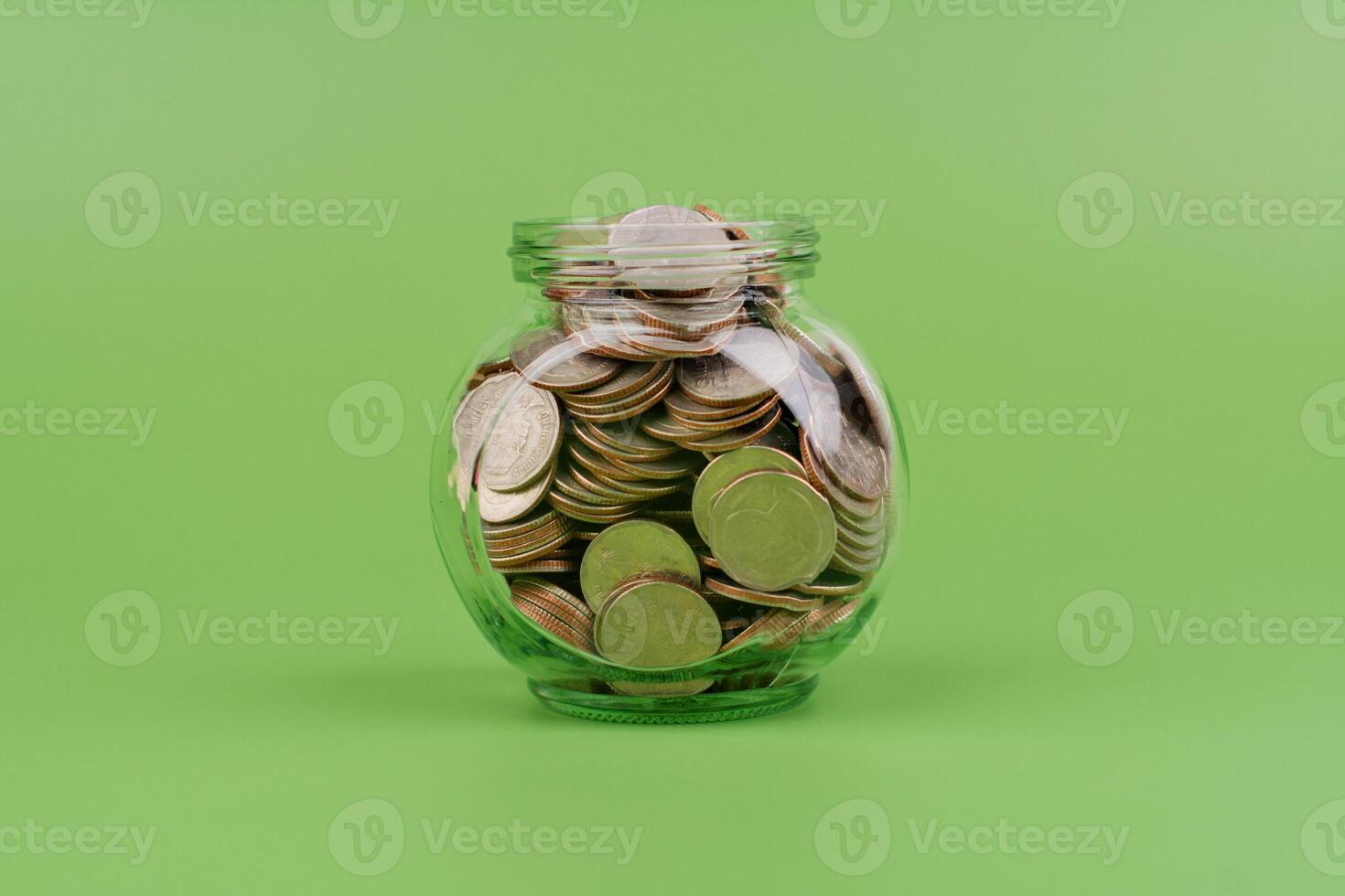 Saving money in a glass bottle, good financial plan financial growth and investment cash flow, income, wages photo
