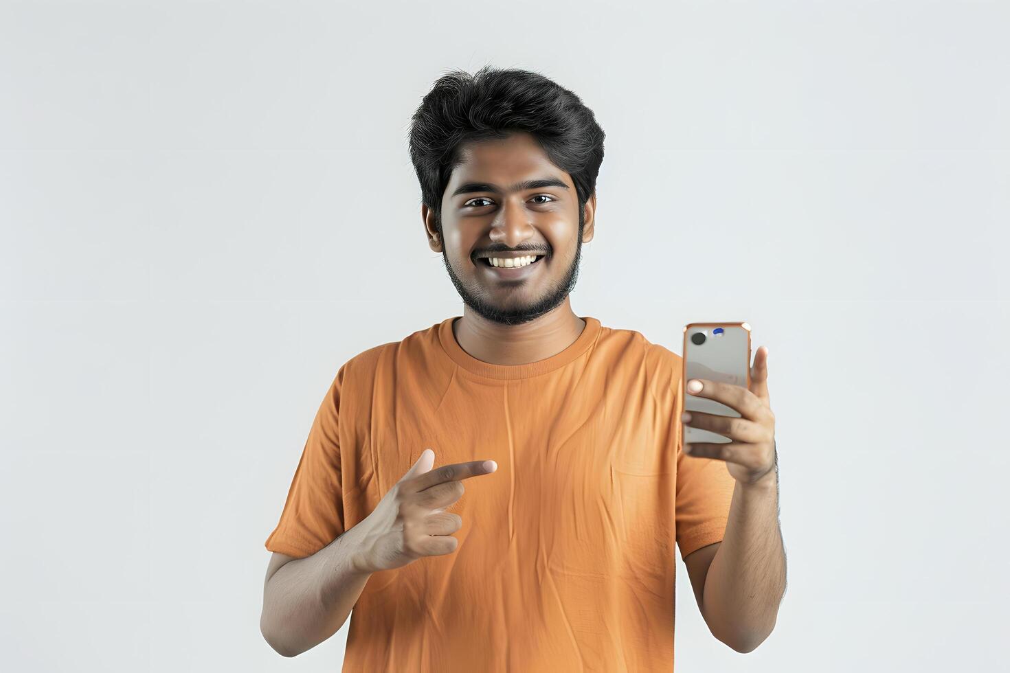 Portrait of happy young indian man using mobile phone and showing thumbs up photo