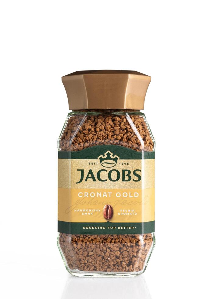 Kyiv, Ukraine, June 5, 2024. Jar of instant coffee Jacobs Cronat Gold isolated on white background . photo