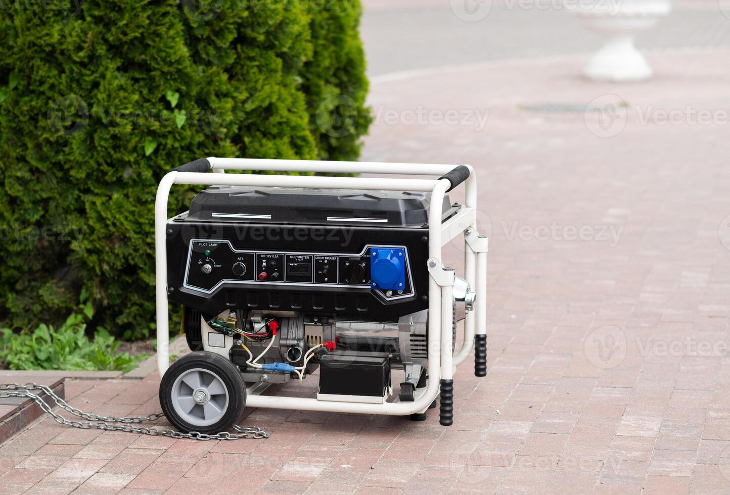 Power supply generator placed on street sidewalk. outdoor diesel power generator in Ukraine. photo