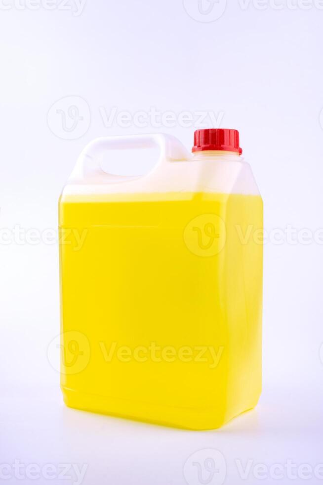 Plastic canister with pen and red cap, yellow liquid, mock up object, isolated on white background. photo