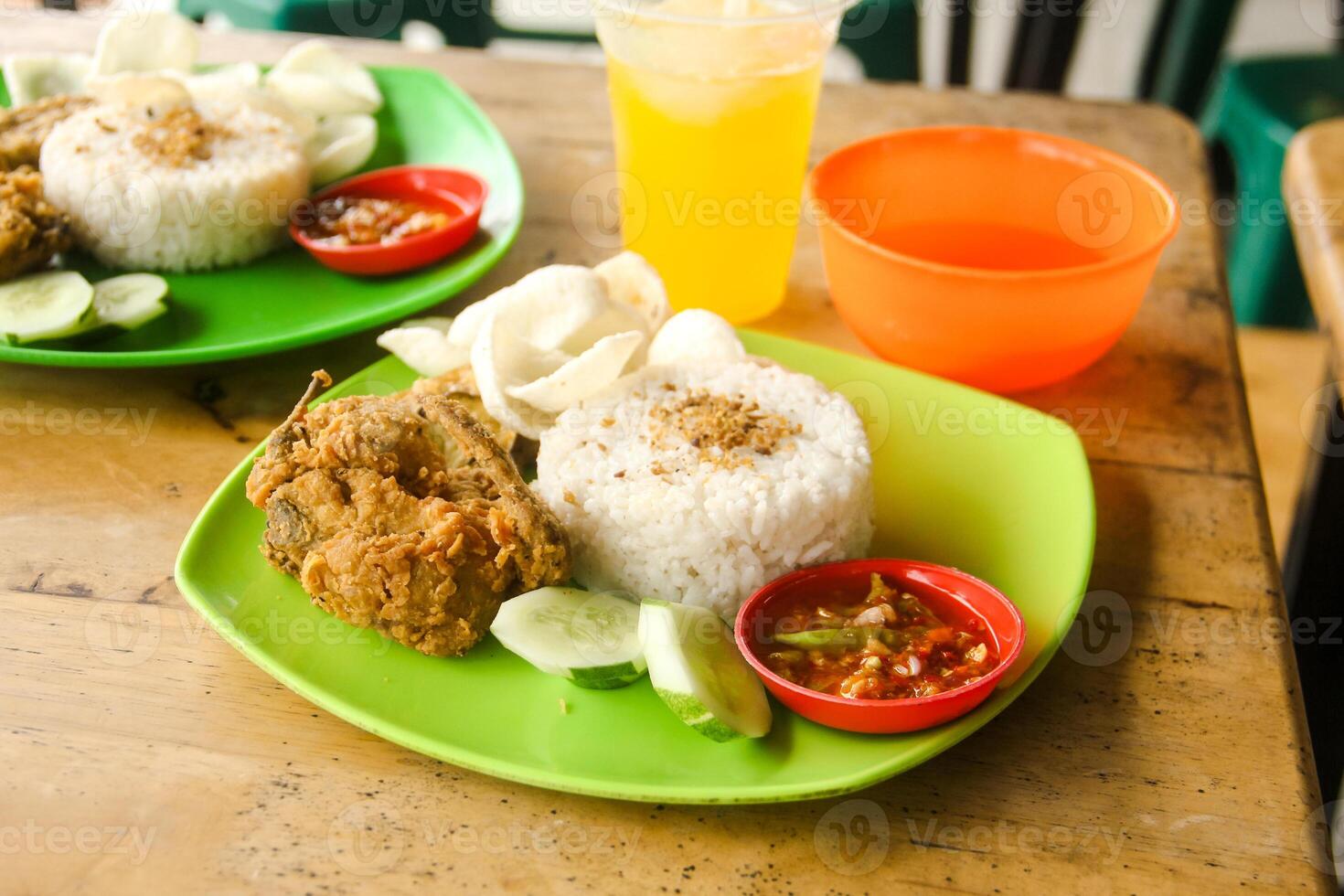 Ayam Geprek or chicken crush is a typical Indonesian food that is much sought after by Indonesian people photo