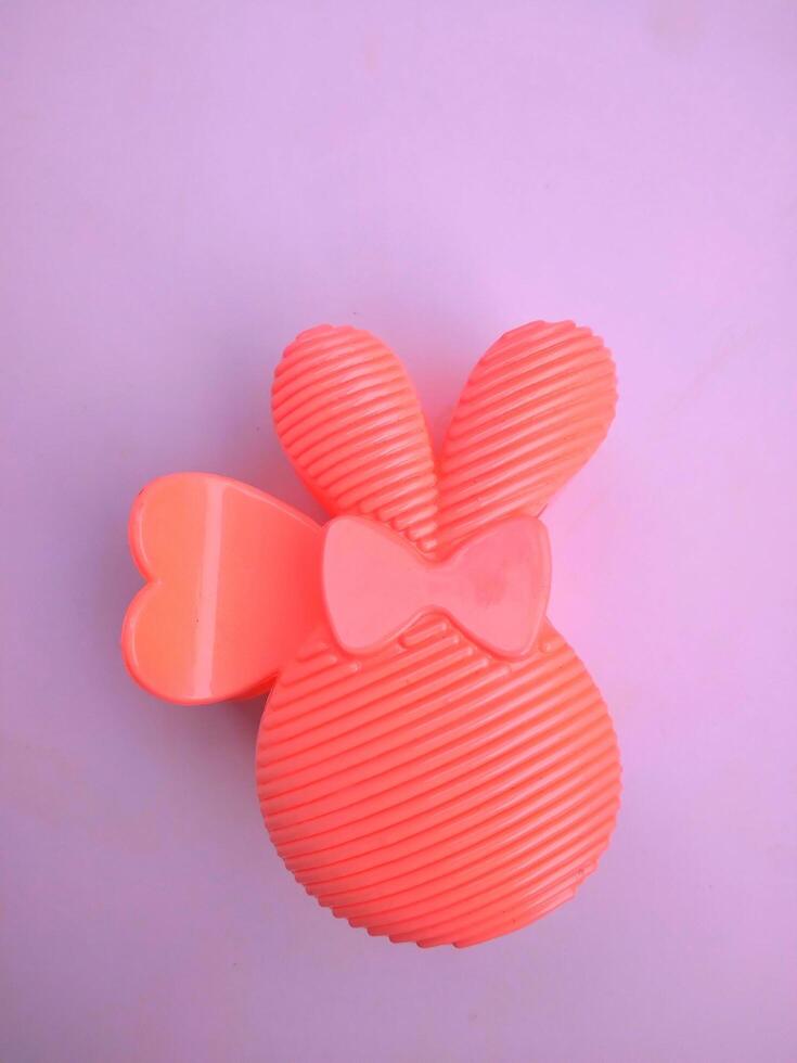 The pink hair clip in the shape of a rabbit looks adorable and beautiful when worn photo
