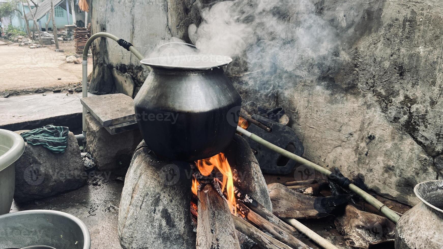 Traditional cooking method at a village using a firewood photo