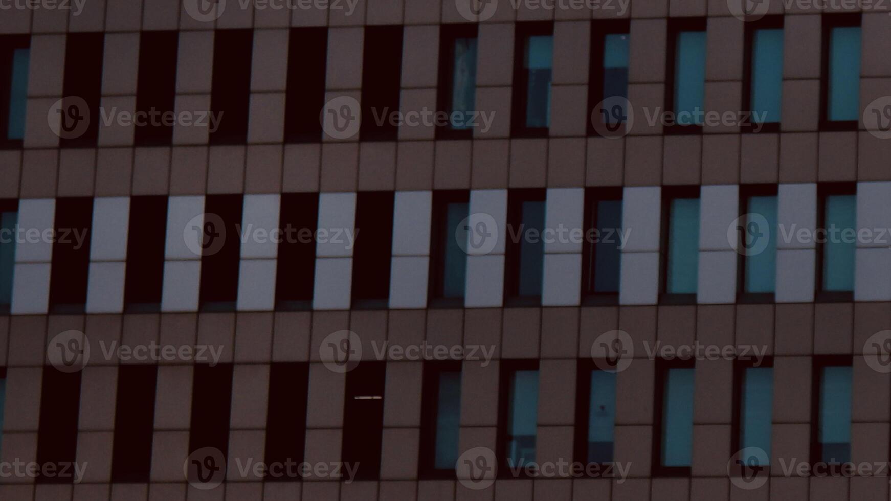 Rows of windows at each center of the painted brick photo