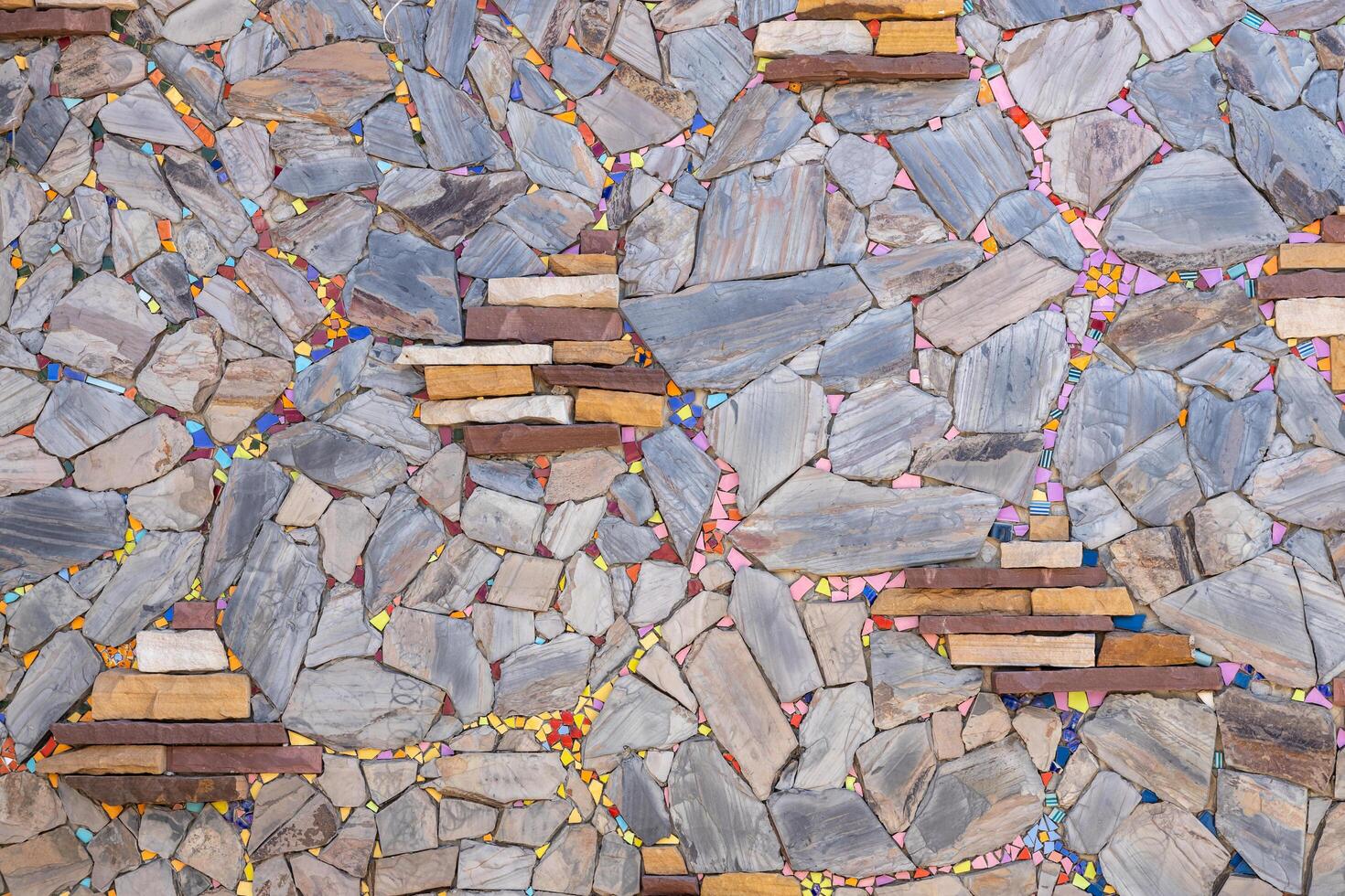The background wall, which is made from scraps of granite slabs placed together. photo