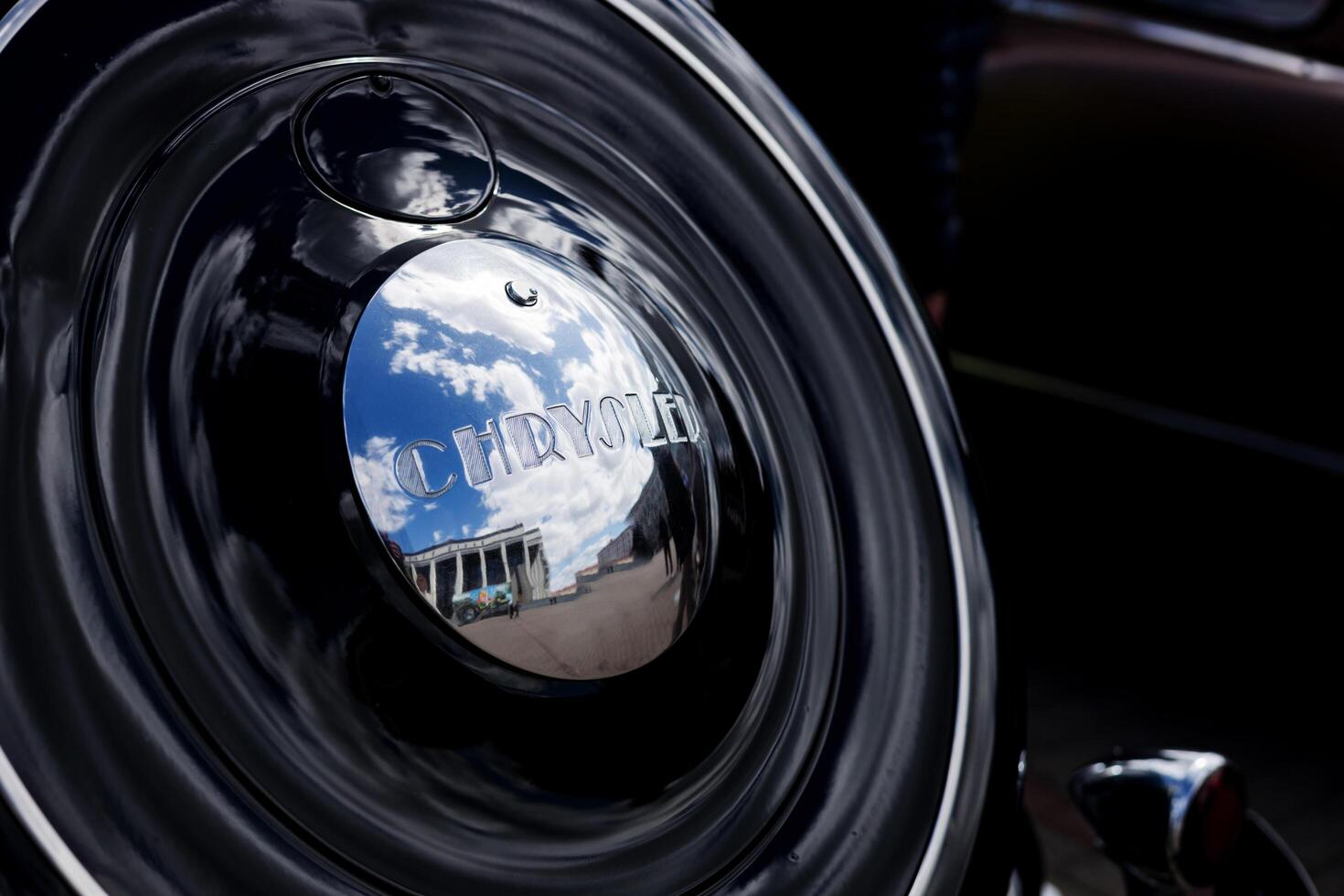 Minsk, Belarus, May 16, 2024 - car spare wheel Classical american auto Chrysler photo