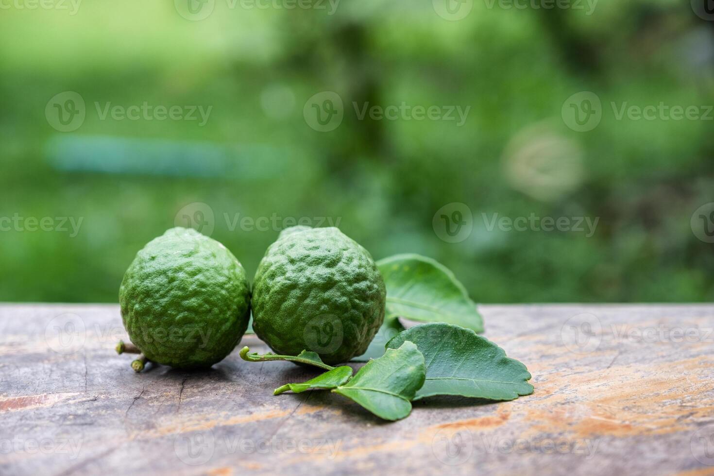 Bergamot fruit with leaf from garden on wood table photo