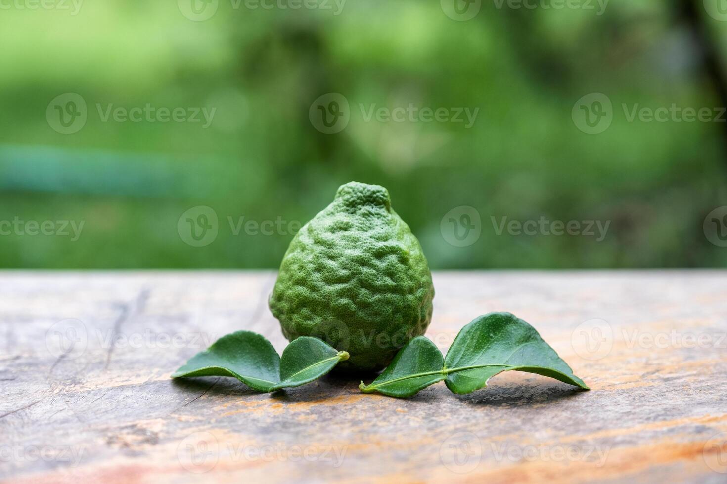 Bergamot fruit with leaf from garden on wood table photo