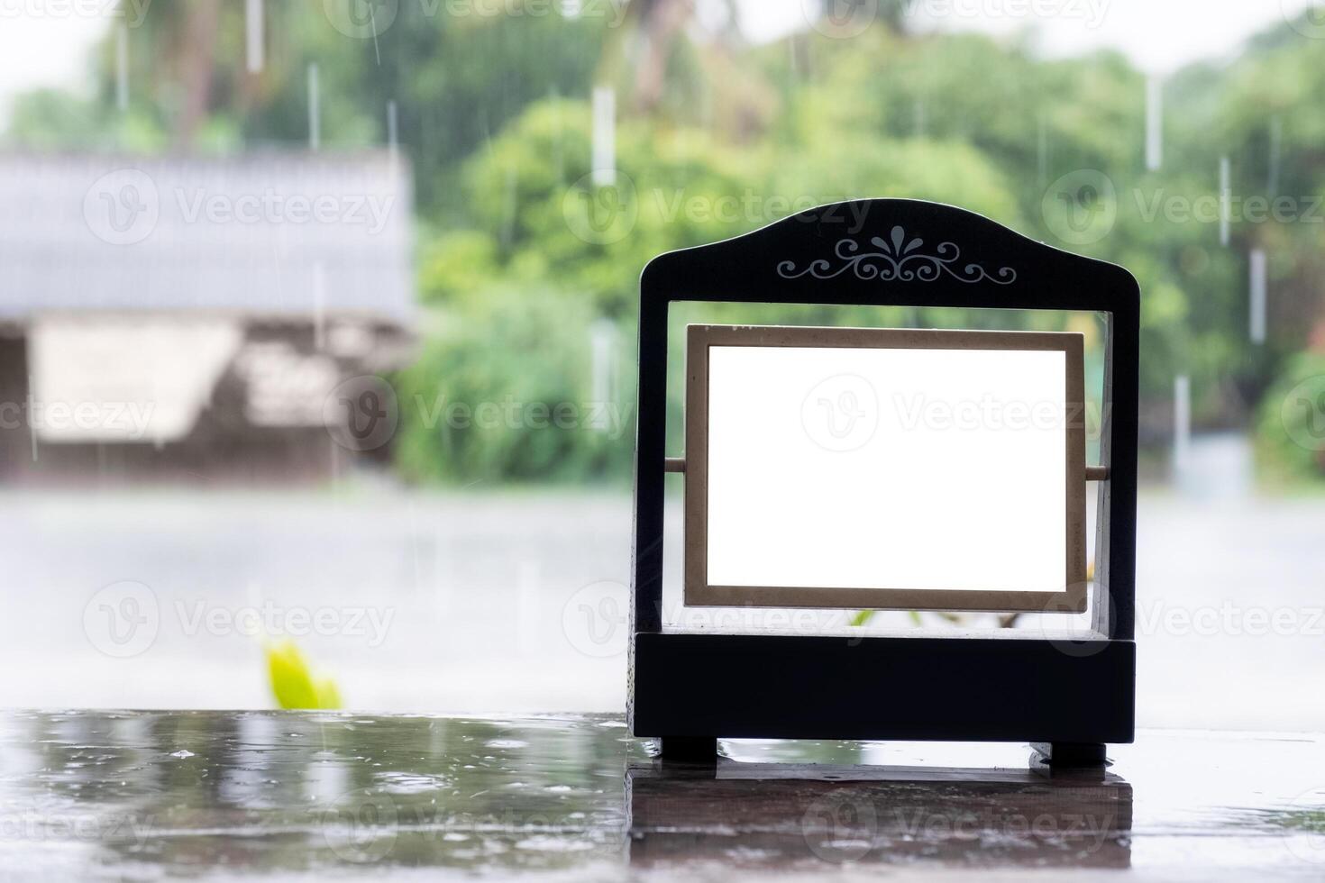 Empty picture frame vintage design with rainy photo