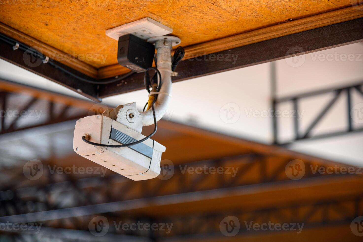 White dirty bullet CCTV closed-circuit television camera photo