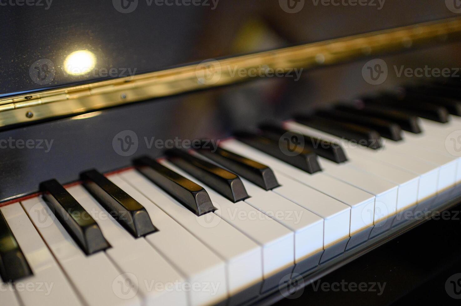 Piano keyboard instrument with shining background. selective focus photo