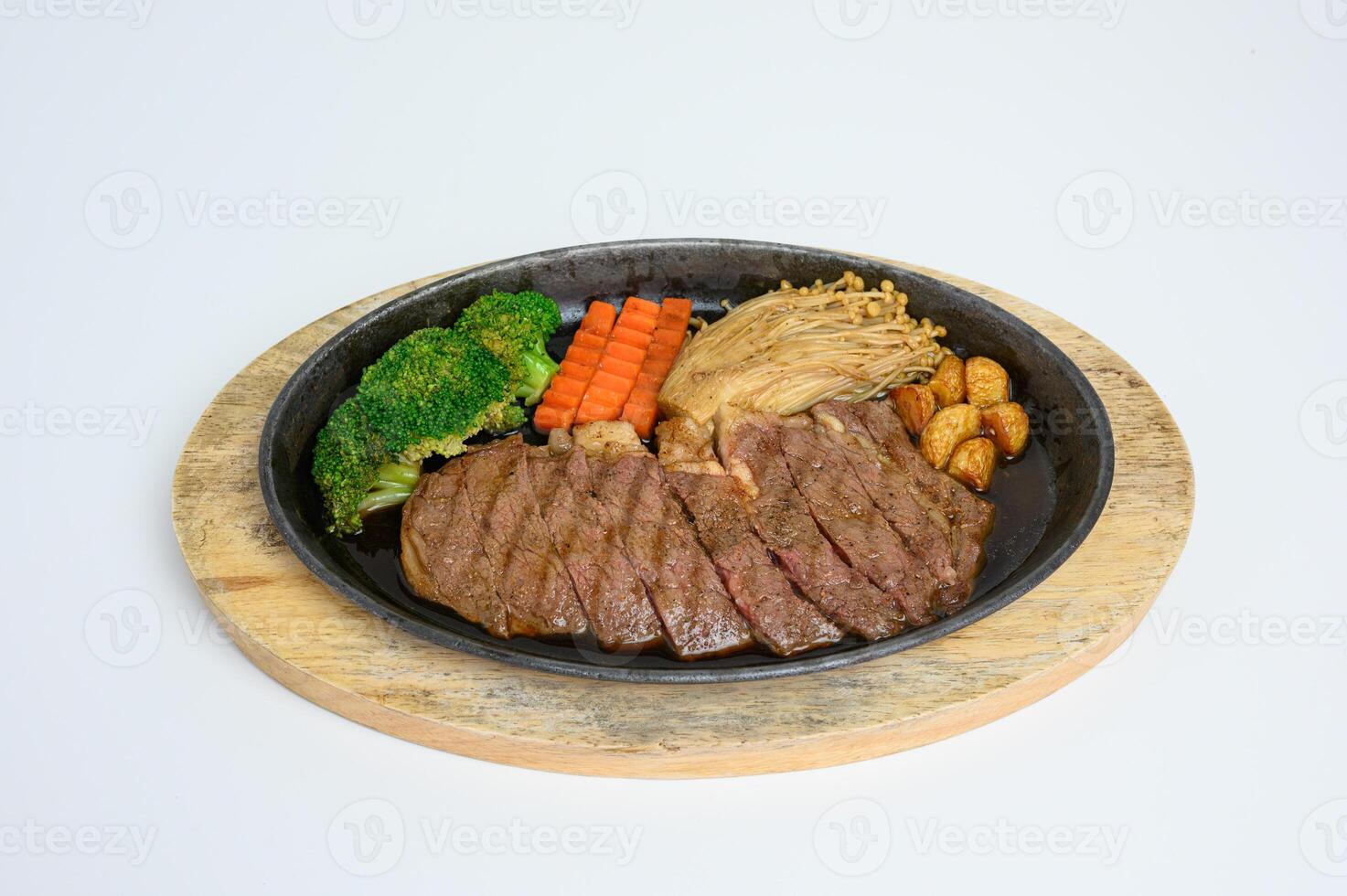 Japanese wagyu beef slices set with vegetables on wooden tray photo