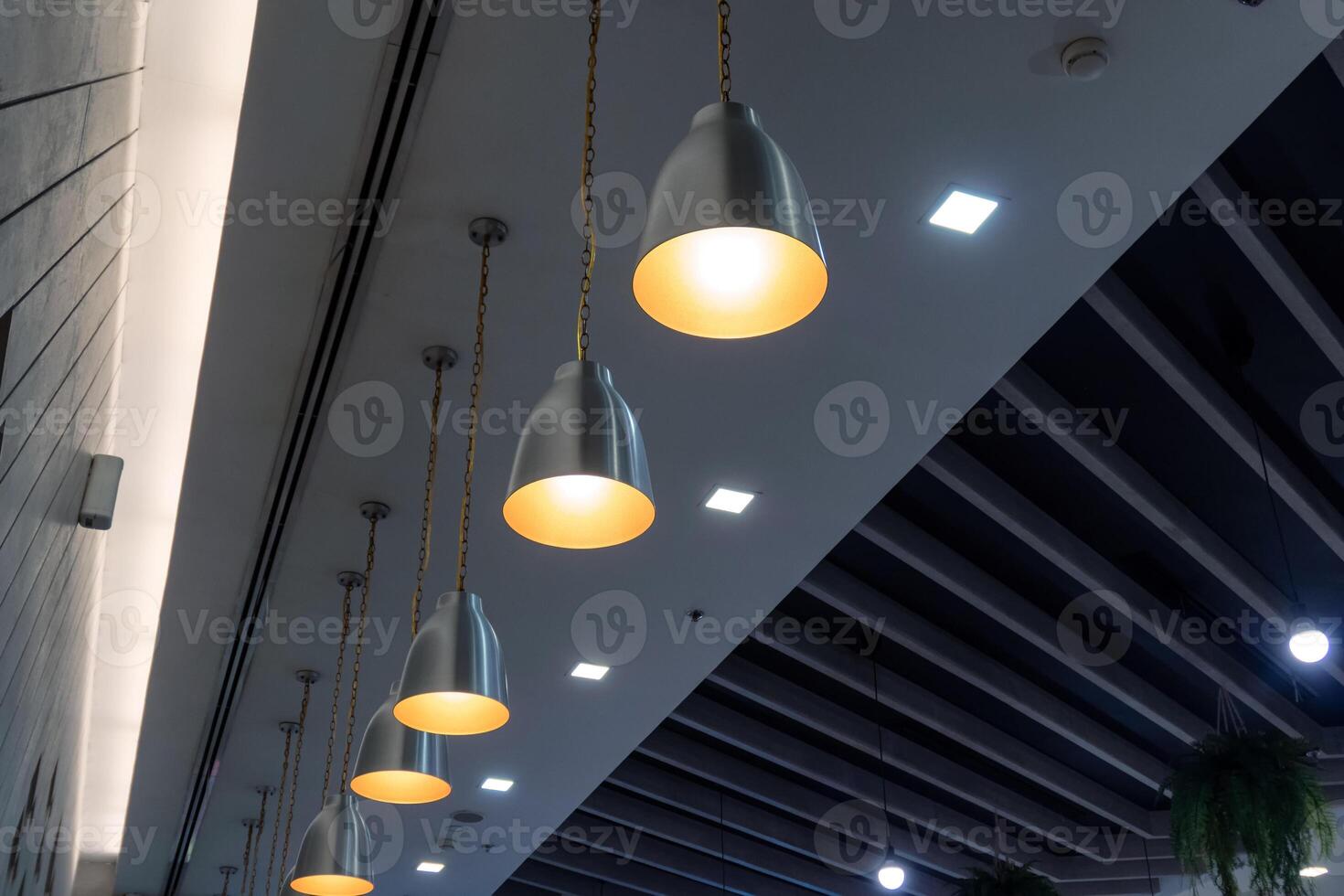 Modern lamps arrangement hanging on ceiling photo