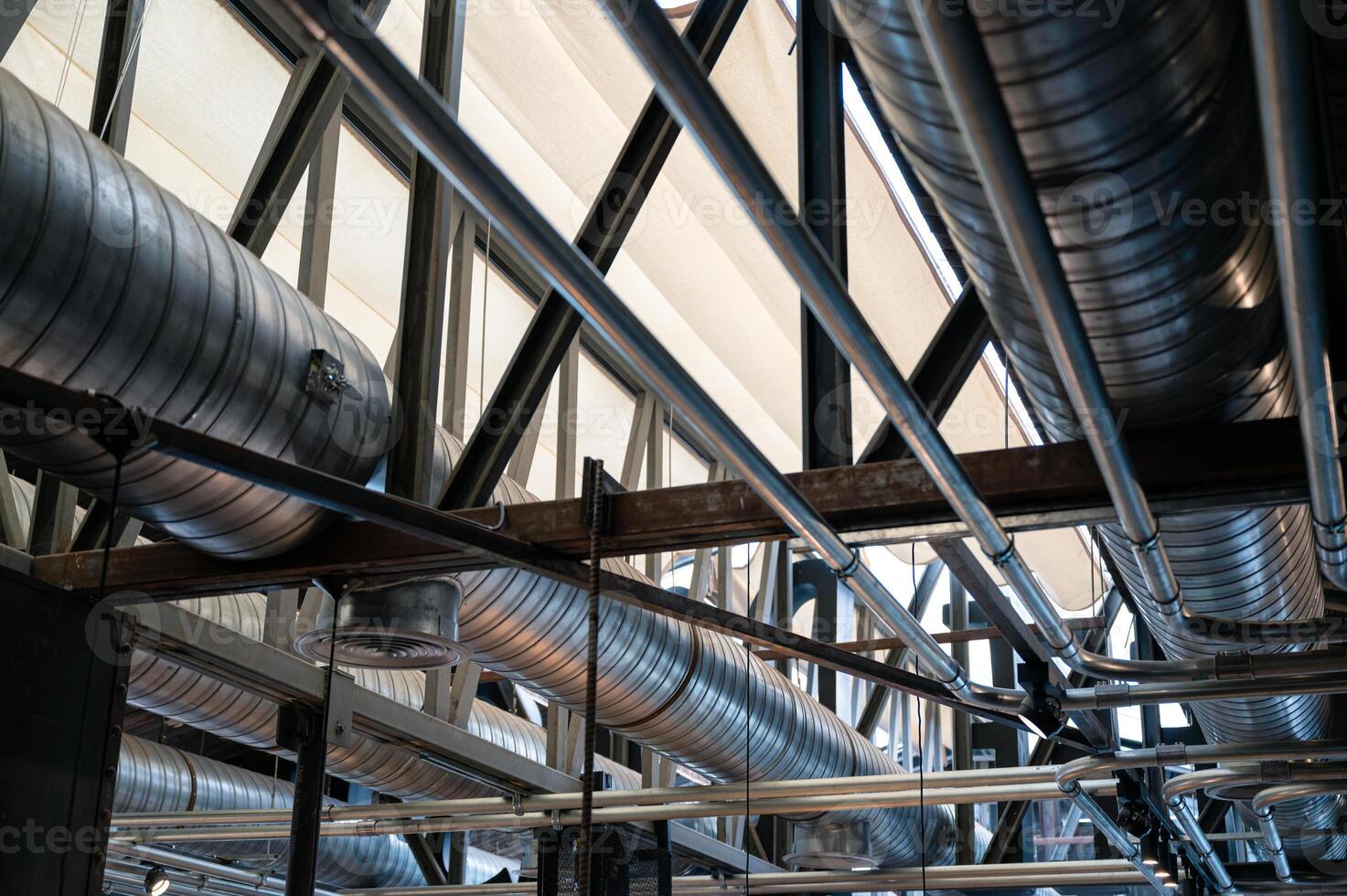 Ceiling structure with steel ventilation pipe and pipe systems photo