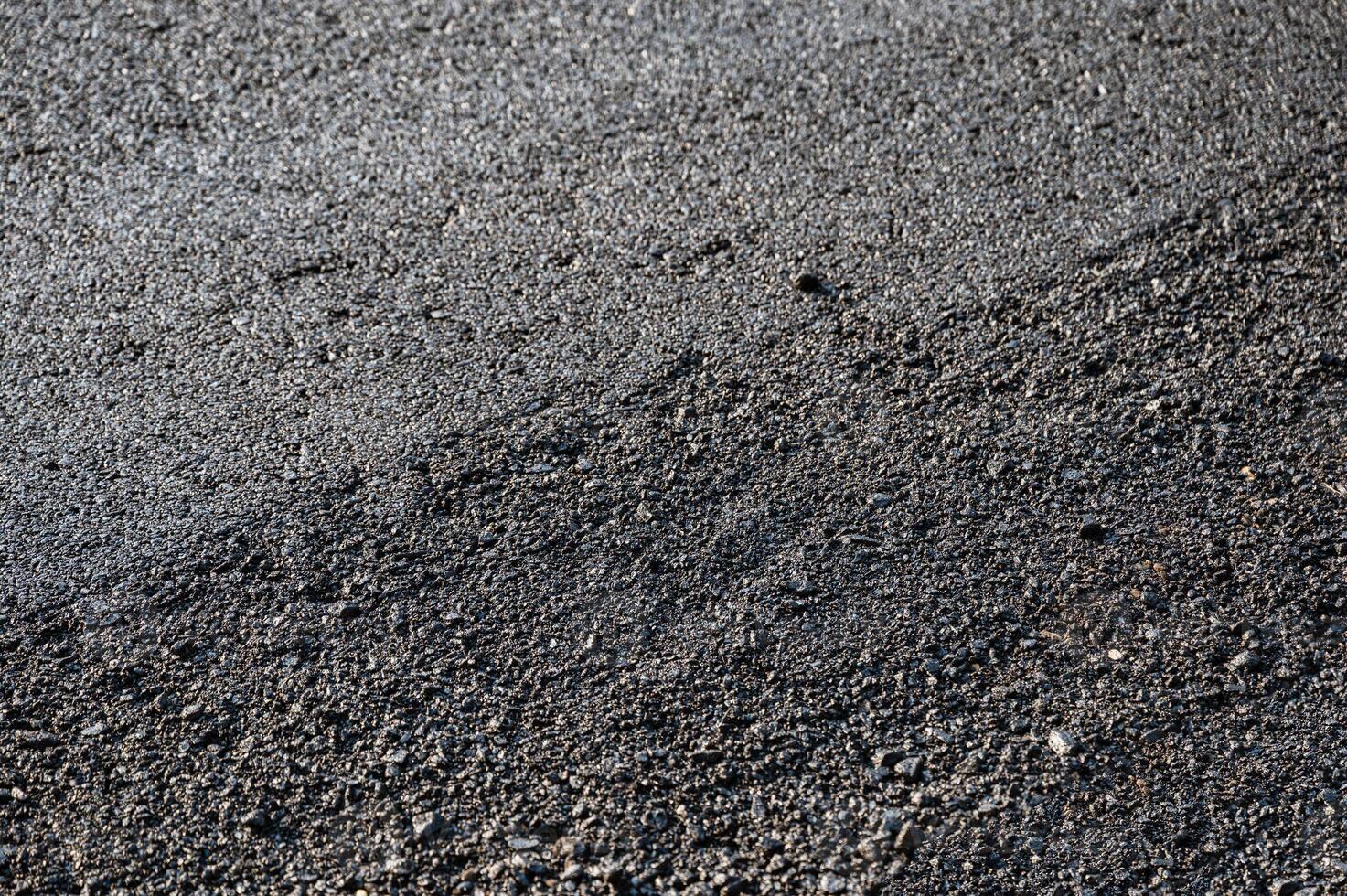 New asphalt tarmac texture road of repairing on the damaged highway photo