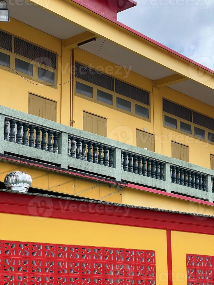 red and yellow building in city photo