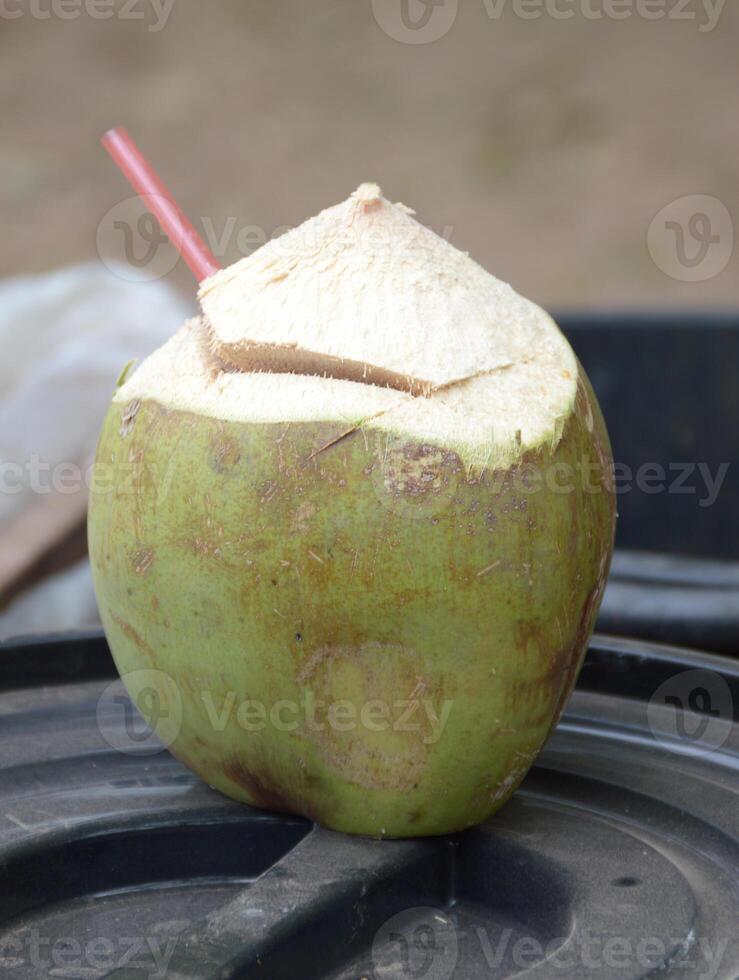 coconut drink with straw photo