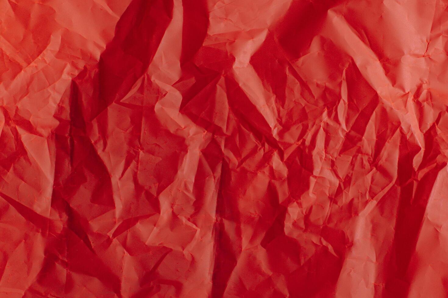 Bright red paper background. Concept for holiday. photo