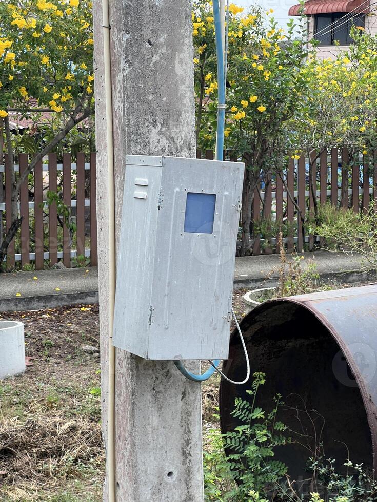 a rusty old telephone box in a park. photo