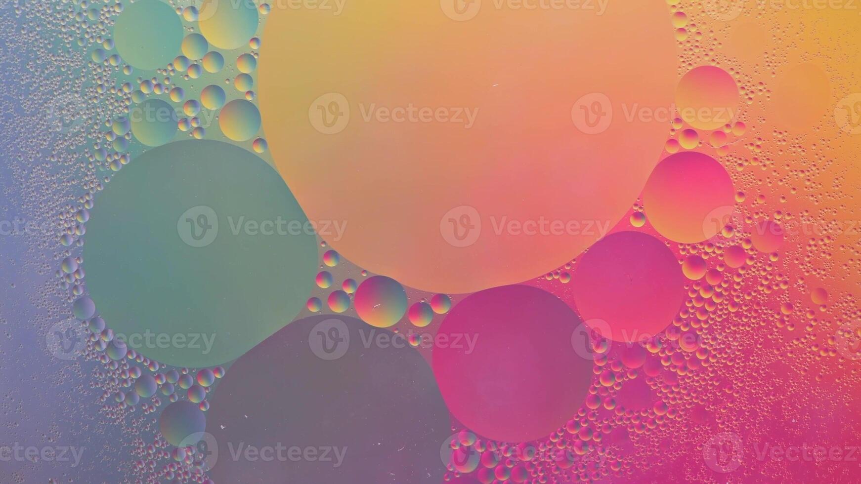 Abstract yellow, green and pink colorful background with oil on water surface. Oil drops in water abstract psychedelic, abstract image. photo