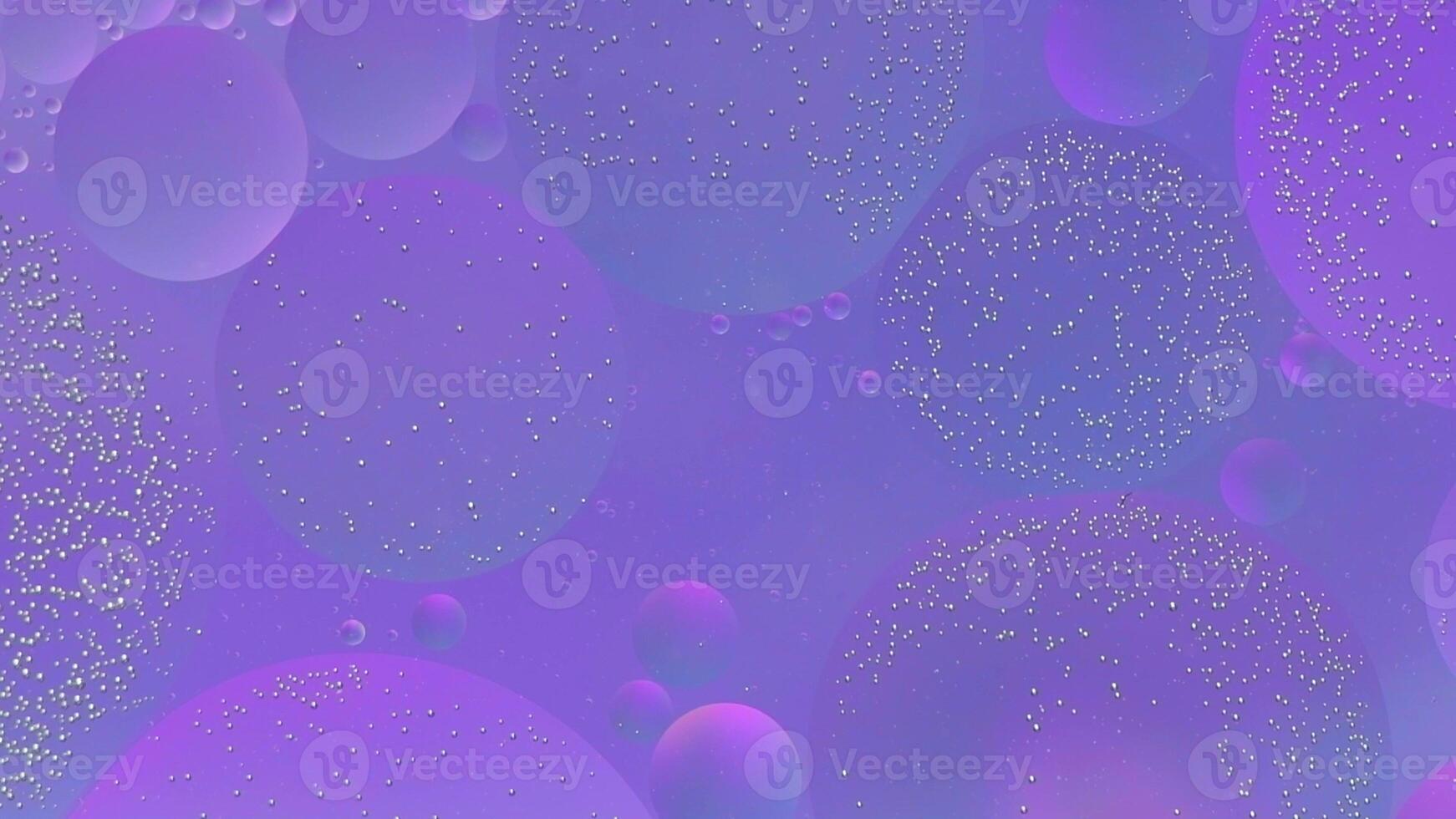 Abstract pink, purple colorful background with oil on water surface. Oil drops in water abstract psychedelic, abstract image. photo