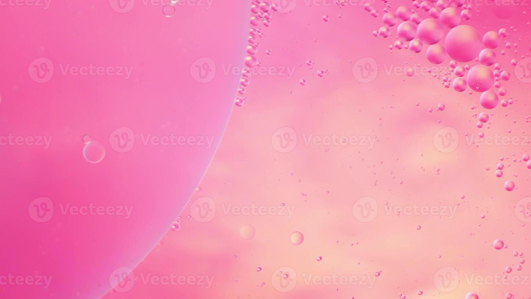Abstract pink colorful background with oil on water surface. Oil drops in water abstract psychedelic, abstract image. photo