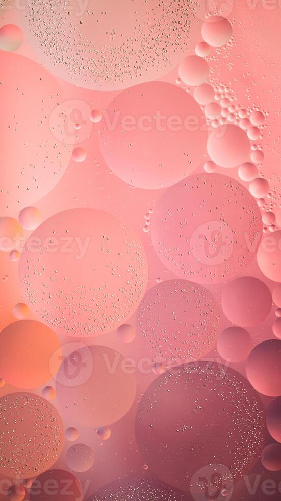 Abstract pink colorful background with oil on water surface. Oil drops in water abstract psychedelic, abstract image. photo