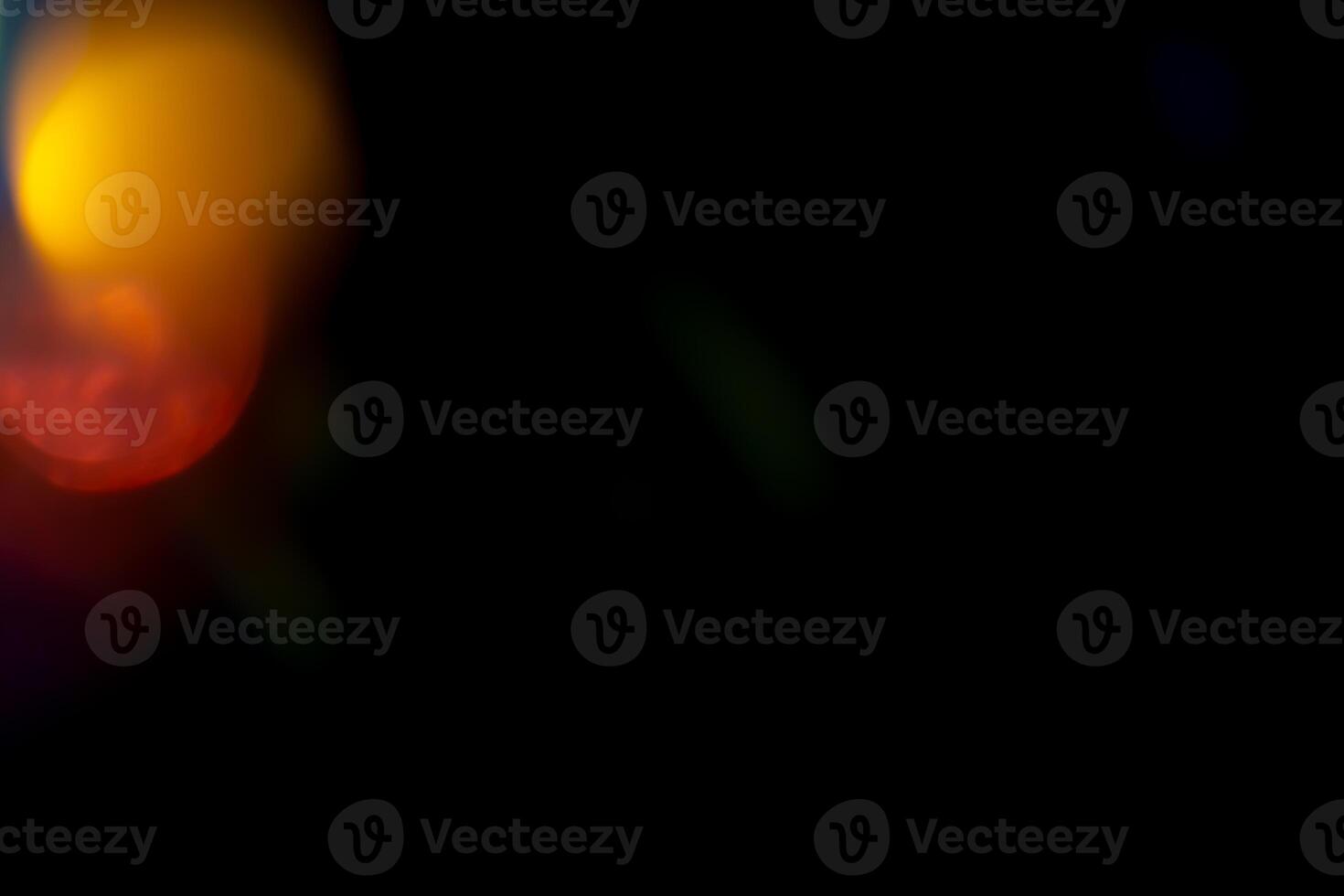 Multicolored highlights on a black background. for overlay to create a festive, vibrant effect photo