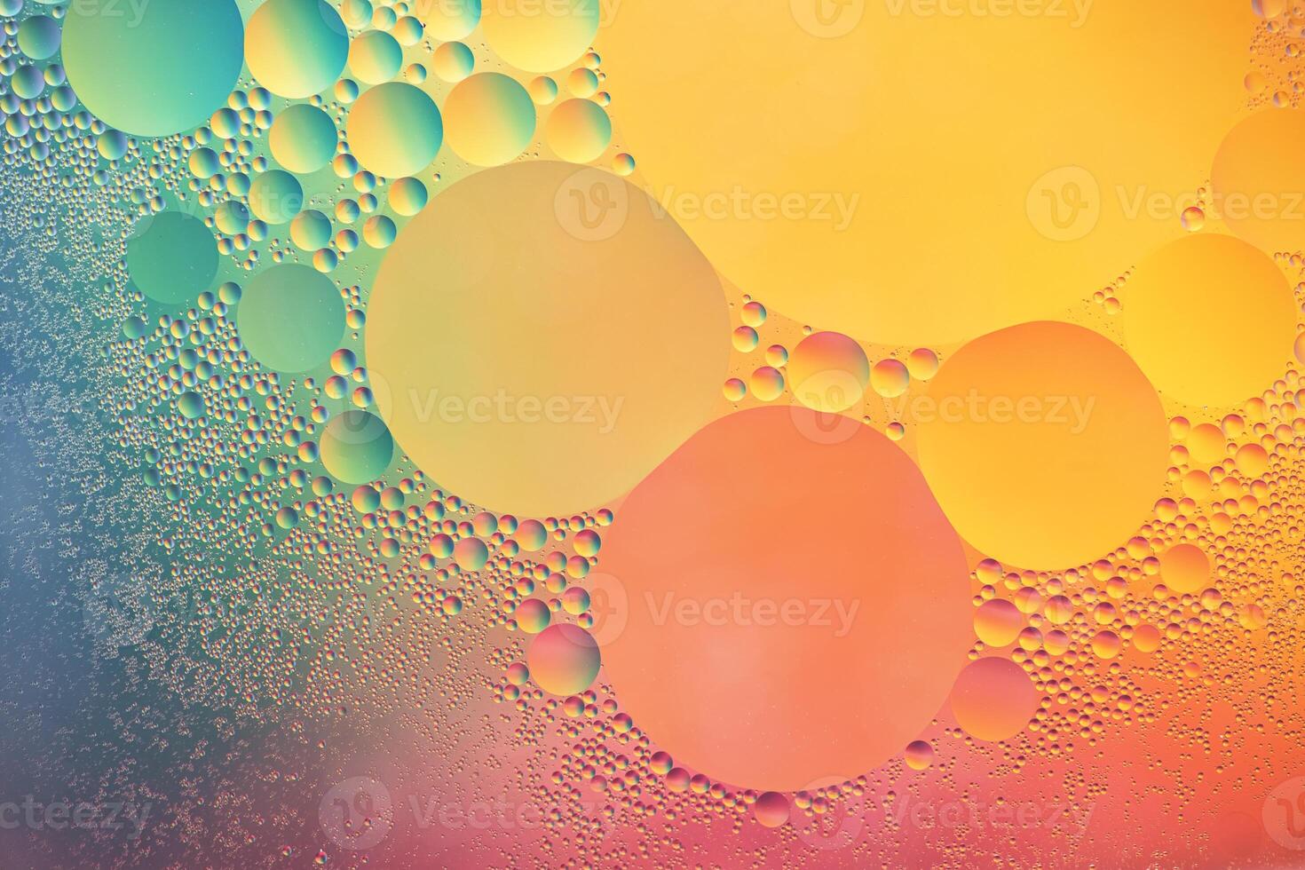 Abstract yellow, green, pink and blue colorful background with oil on water surface. Oil drops in water abstract psychedelic, abstract image. photo