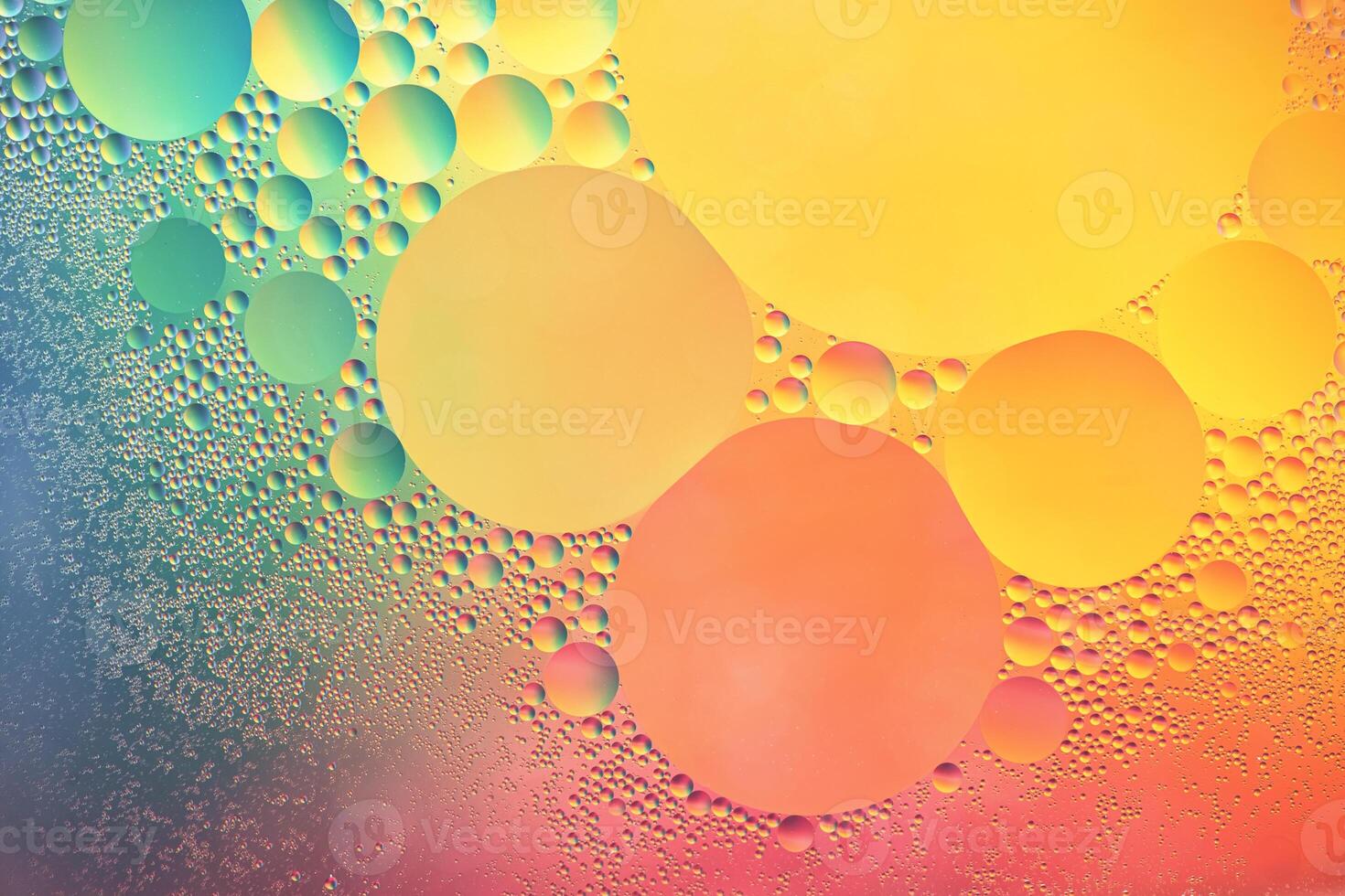 Abstract yellow, green and pink colorful background with oil on water surface. Oil drops in water abstract psychedelic, abstract image. photo