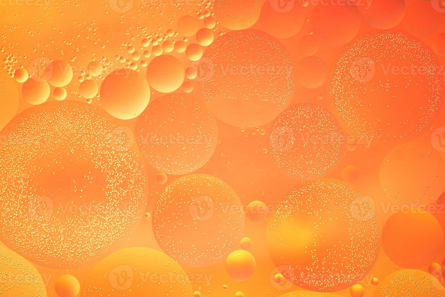 Abstract orange colorful background with oil on water surface. Oil drops in water abstract psychedelic, abstract image. photo