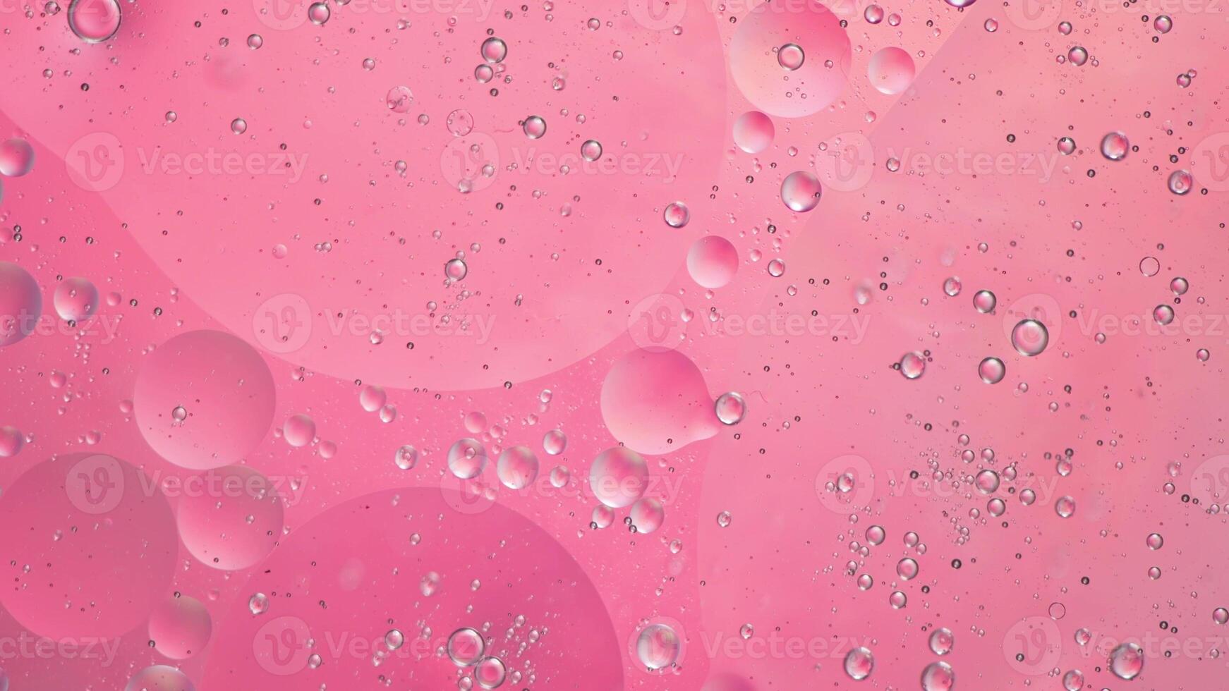 Abstract pink colorful background with oil on water surface. Oil drops in water abstract psychedelic, abstract image. photo