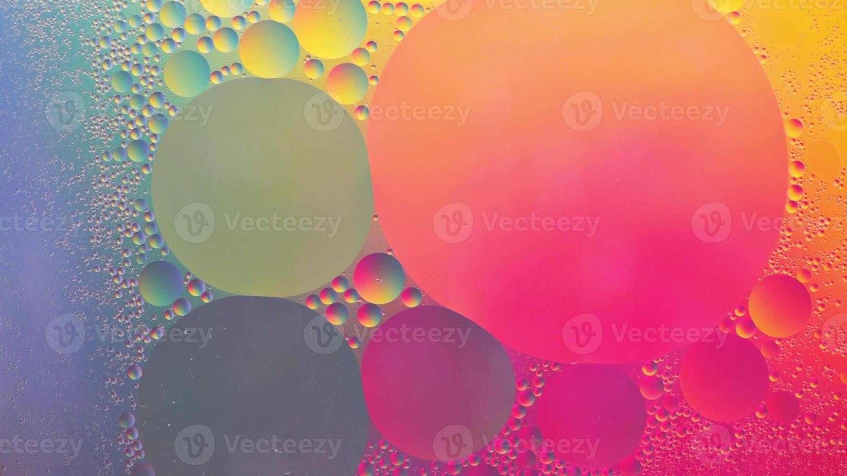 Abstract yellow, green and pink colorful background with oil on water surface. Oil drops in water abstract psychedelic, abstract image. photo