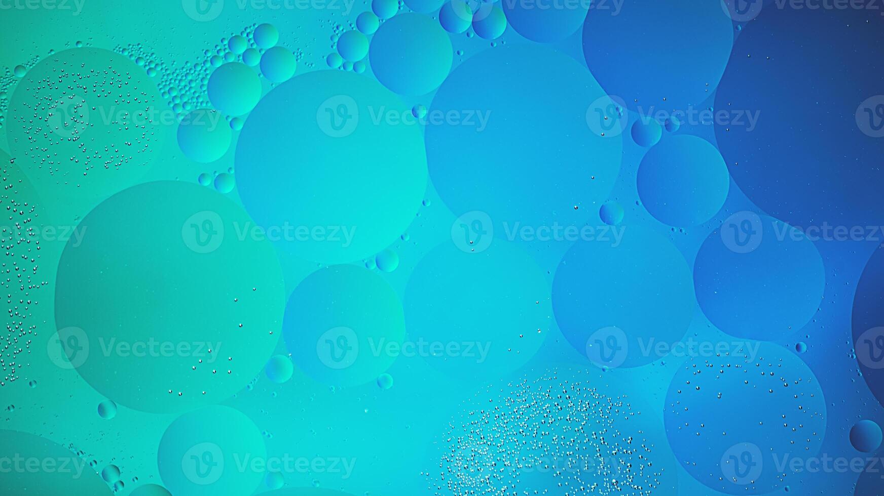 Abstract blue and green colorful background with oil on water surface. Oil drops in water abstract psychedelic, abstract image. photo