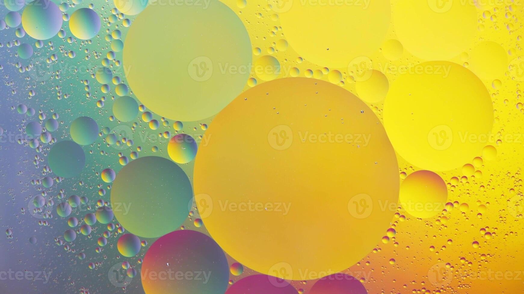 Abstract yellow, green and pink colorful background with oil on water surface. Oil drops in water abstract psychedelic, abstract image. photo
