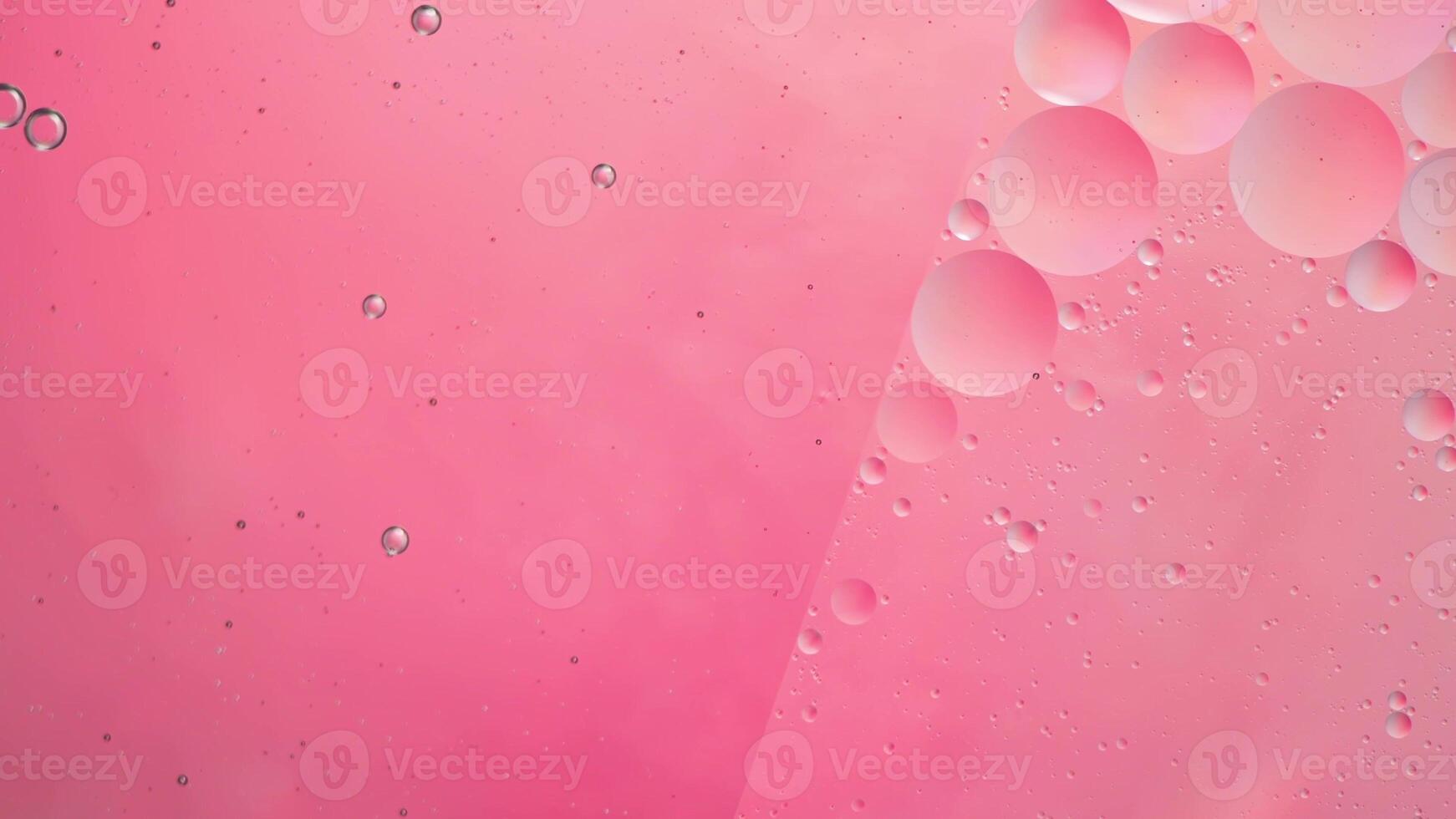 Abstract pink colorful background with oil on water surface. Oil drops in water abstract psychedelic, abstract image. photo