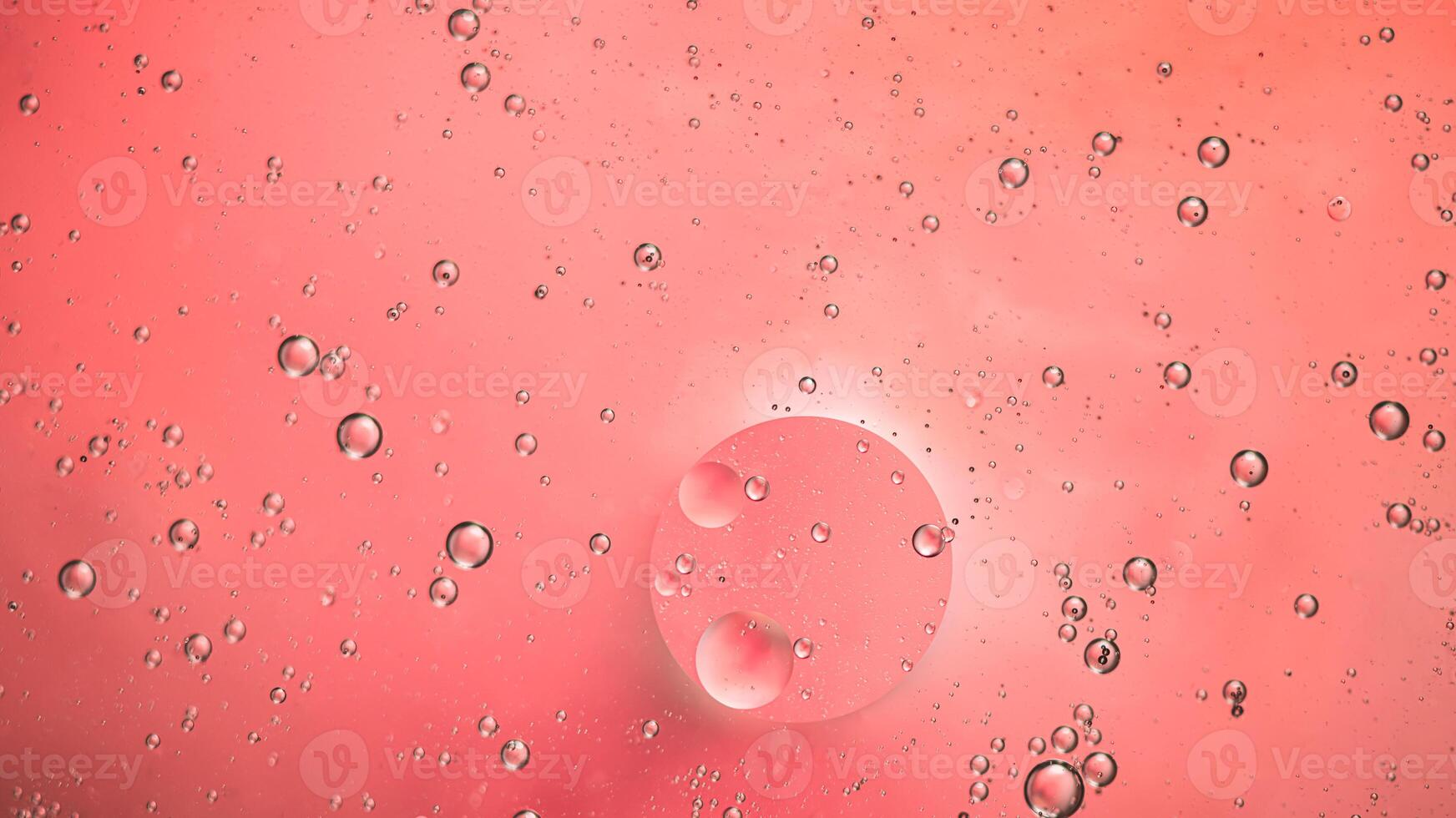 Abstract pink colorful background with oil on water surface. Oil drops in water abstract psychedelic, abstract image. photo