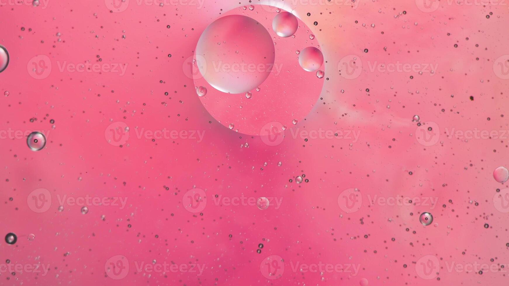 Abstract pink colorful background with oil on water surface. Oil drops in water abstract psychedelic, abstract image. photo